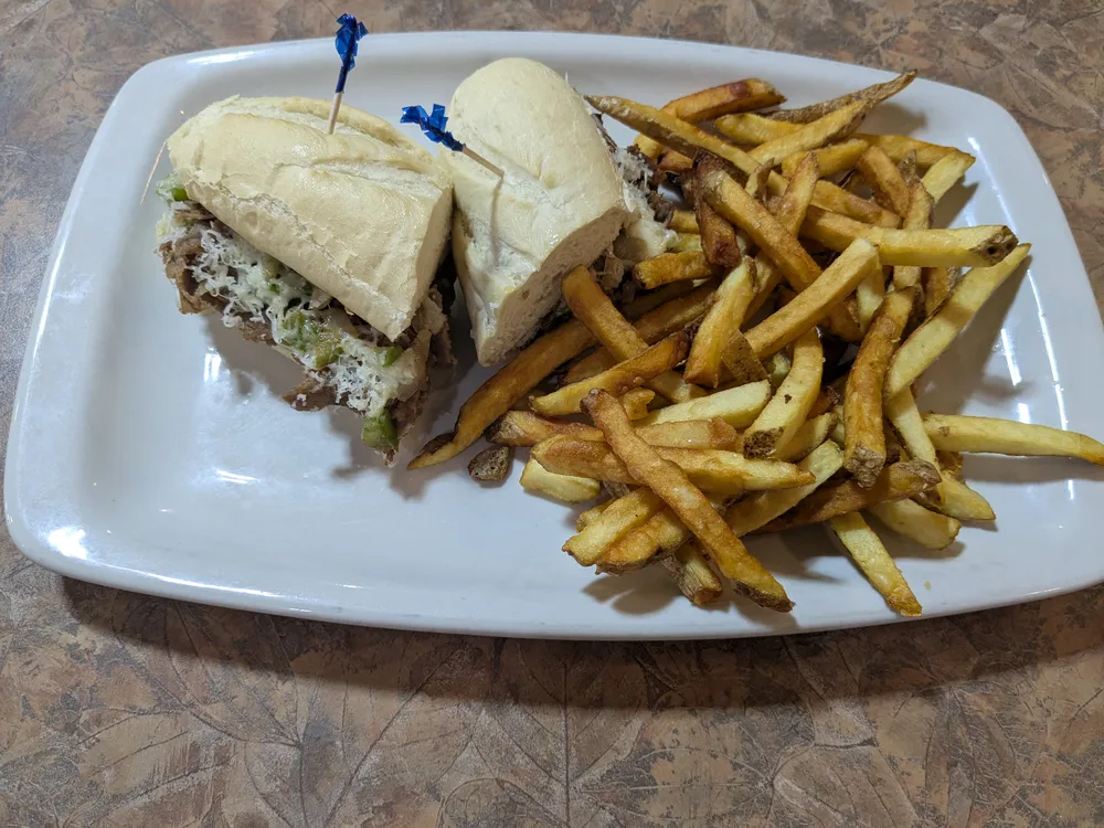 A sandwich with fries